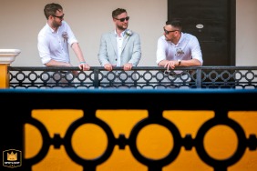   In Lyon, anticipation fills the air as a group of men gathers on a deck for a final conversation before the big wedding.